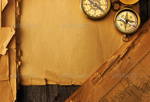 Antique compass over old map - Stock Photo - Images