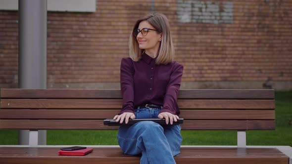 Woman accomplish and finish work on laptop relaxing and feeling happy smiling. alt