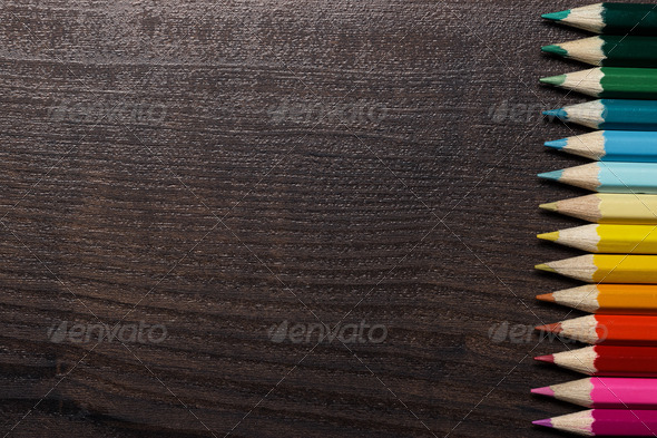 Colorful Pencils On Dark Brown Table Background