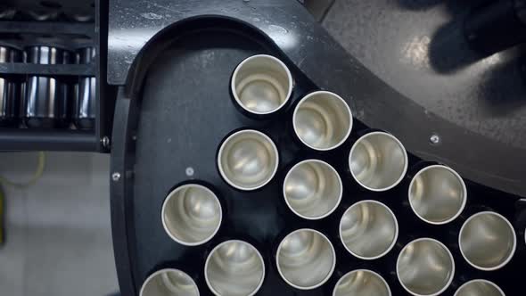 Overhead View Of An Empty Beer Cans Moving On The Conveyor System Of Canning Machine alt