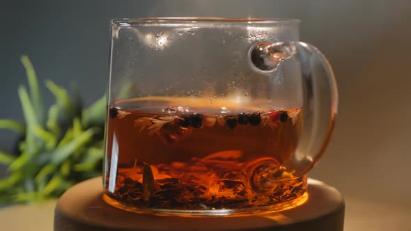 Glass Teapot Filled Hot Herbal Tea Rotates Cyclically alt