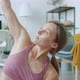 Slow Motion of Active Person Doing Yoga Stretching Arms Indoors in Apartment - VideoHive Item for Sale