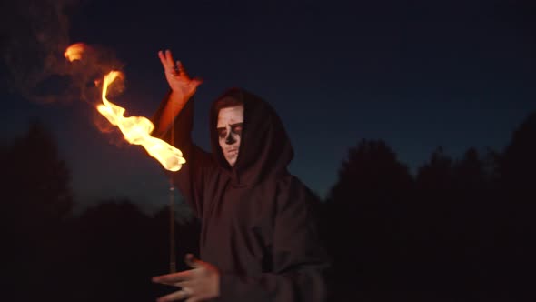 Spooky Grim Reaper Juggling Fireball at Night alt