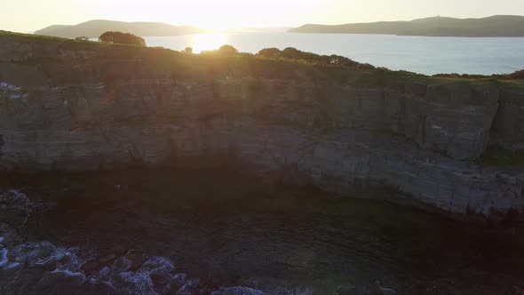Drone View of a Beautiful Peninsula Tobizina with Vertical Cliffs at Sunset alt