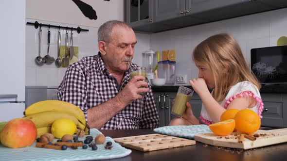 Senior Man with Granddaughter Drinking Smoothie alt