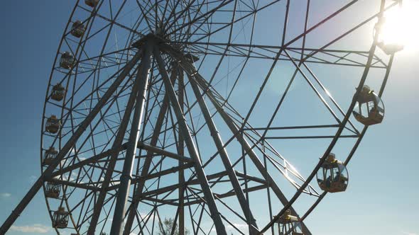 The rotation of the Ferris wheel