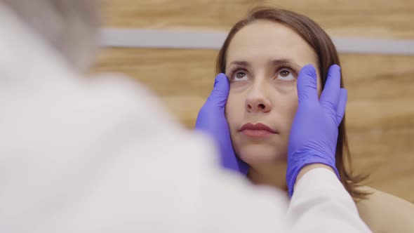 Ophthalmologist Checking Eyes of Female Patient alt