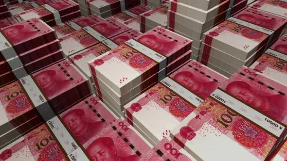 China Yuan 100 banknote packs - flying over CNY money stack