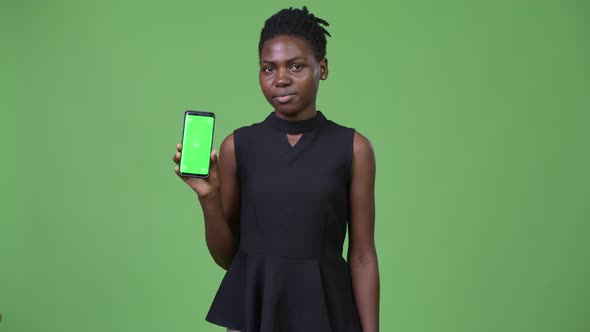 Young Beautiful African Businesswoman Showing Phone
