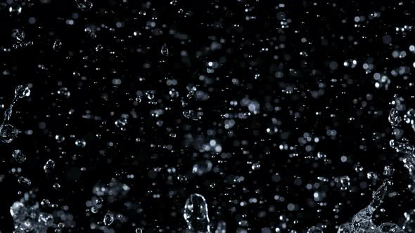 Super Slow Motion Shot of Water Splash Isolated on Black Background at 1000Fps alt