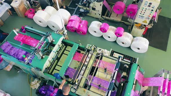 Top View of a Colourful Plastic Bag Manufacturing Machine at a Factory alt