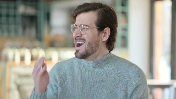 Creative Old Man Having Coughing While Working on Laptop alt