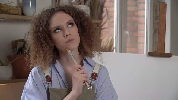 Pensive Woman Artist alt