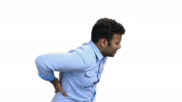 Man Suffering From Backache on White Background alt