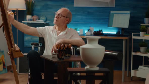 Senior Man Living with Physical Disability and Drawing Authentic Vase alt