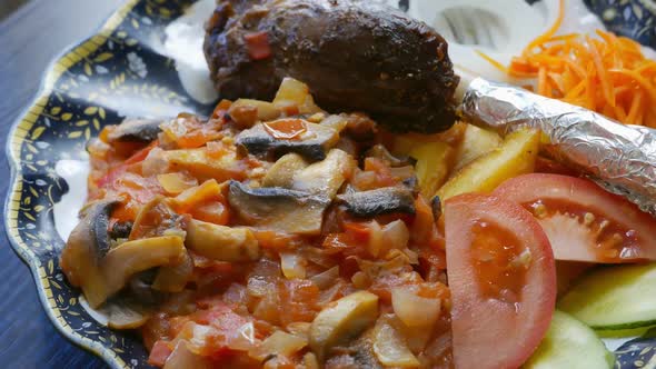Bonein Meat with Vegetables on a Plate