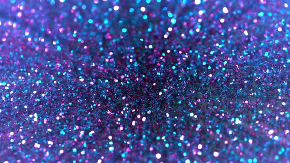 Super Slow Motion Shot of Neon Glitter Background at 1000Fps alt