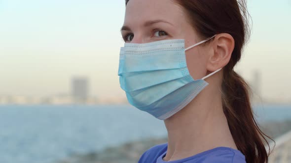 Girl in Medical Mask with Sea View 