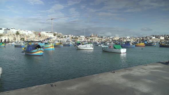 Port of Marsaxlokk- Taditional Fishing Village in Malta on a Sunny Winter Day in December