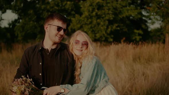 Affectionate Happy Loving Stylish Couple Walking and Embracing alt