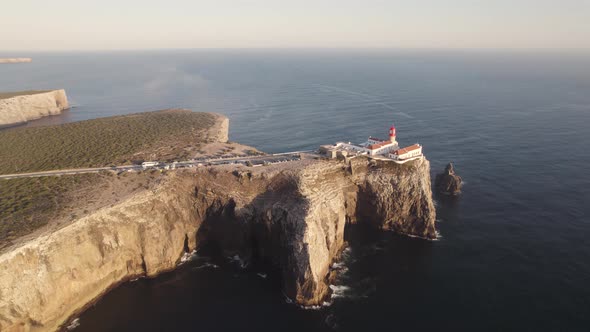 Descending aerial of Farol de Sagres, part of the Algarve region in Portugal alt
