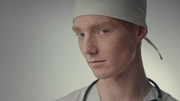 Face Of Young Doctor In White Hat alt