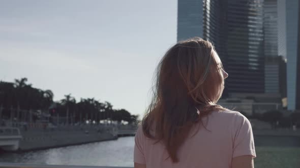 Woman Enjoying View of Downtown Singapore