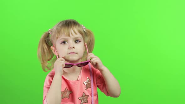 Positive Girl in Pink Blouse and Sunglasses Dancing and Posing. Chroma Key alt