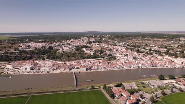 Stunning cityscape of Alcacer do Sal, Portugal. Aerial pull out alt