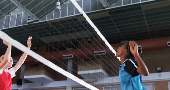 Female players playing volleyball in the court 4k alt