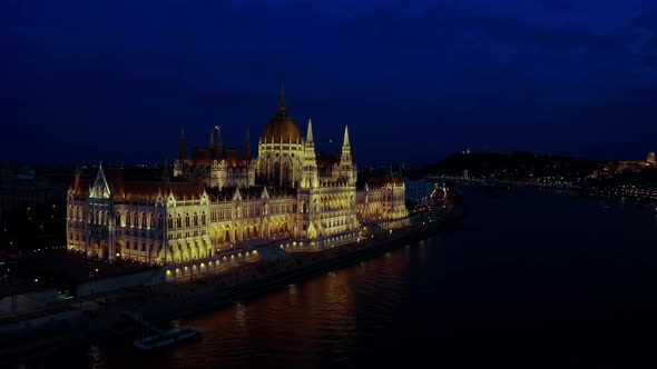 Aerial Wide Footage of Danube River and Budapest City Skyline at Night Time alt