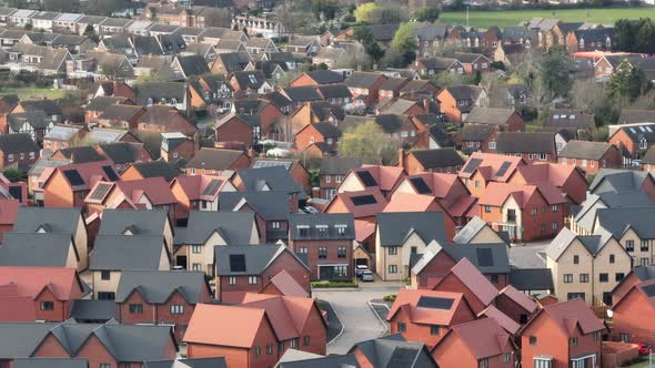 Modern Houses and Homes on a UK New Build Estate Seen From The Air alt
