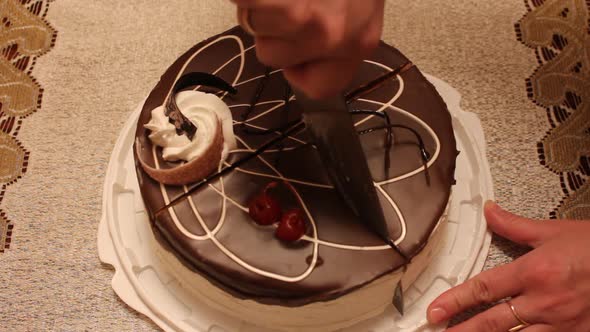 Cutting chocolate cake