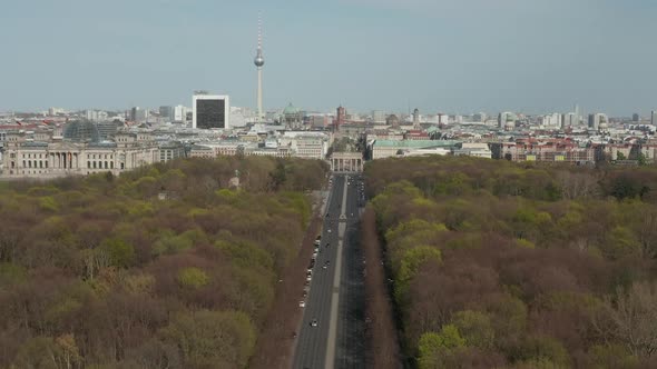 AERIAL: Strasse des 17. Juni with View on Brandenburg Gate in Berlin, Germany on Sunny Day alt