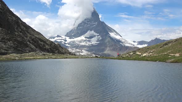 Scenic view on snowy Matterhorn peak and lake Stellisee