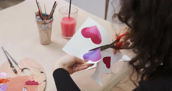 Cutting a Card for St Valentine's Day From Paper