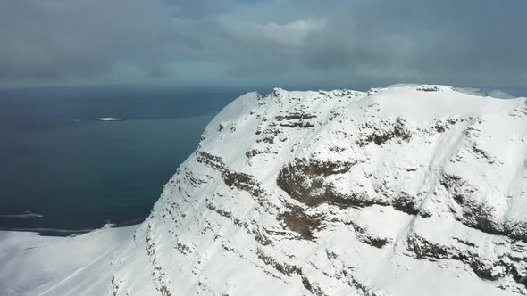 Bird's-eye View of the Snowy Mount Kirkjufetl, Iceland, Winter 2019