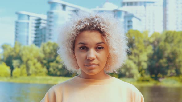 Young Girl Shows Astonishment Outdoors Portrait alt