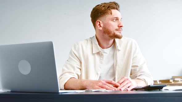 Thoughtful startup manager with beard looks aside and thinks alt