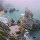  View of Rocks in Morning Fog at Praia Da Ursa Beach in Sintra, Portugal - VideoHive Item for Sale