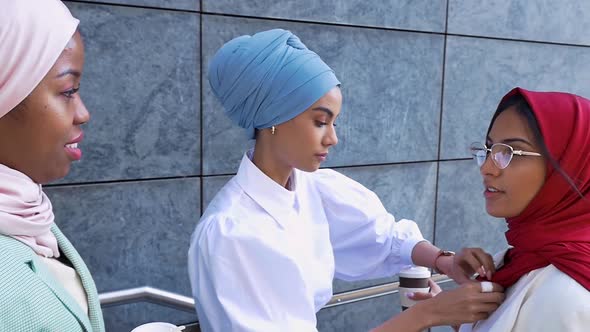 Arabian friends going out in the city alt