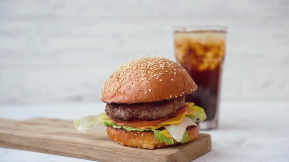 Fresh Tasty Burger Served with Soda and French Fries on White Table alt