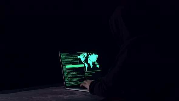 Hacker Using Laptop Computer Hacking In The Dark Room alt