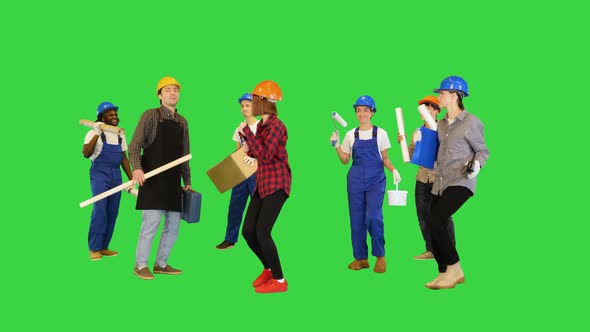 Group of Multiethnic Construction Workers Dancing on a Green Screen Chroma Key