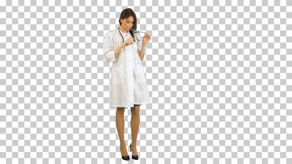 Young beautiful nurse posing with stethoscope, Alpha Channel