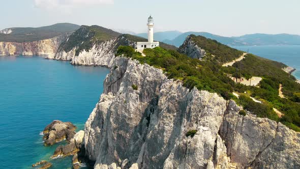 Aerial drone view of the Ionian Sea coast of Zakynthos, Greece. Rocky ridge with lighthouse alt