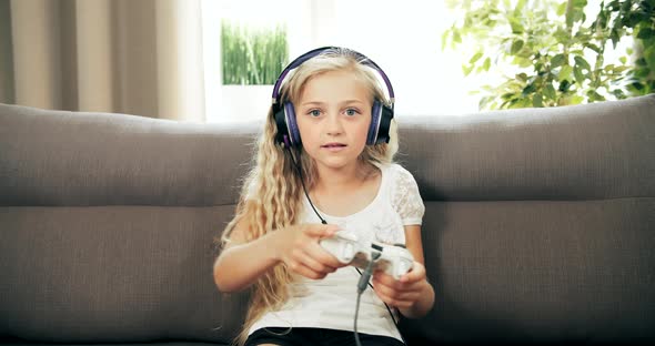 Girl Playing Video Game with Joystick