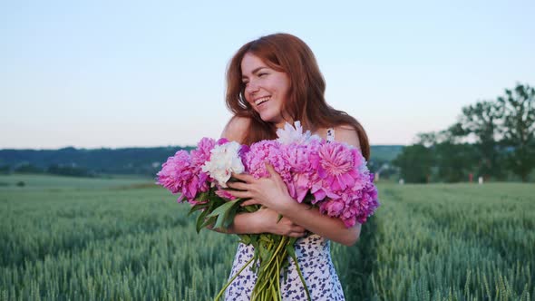 Woman Holding Pink Flowers Peonies Looking Ahead Enjoying Freedom alt