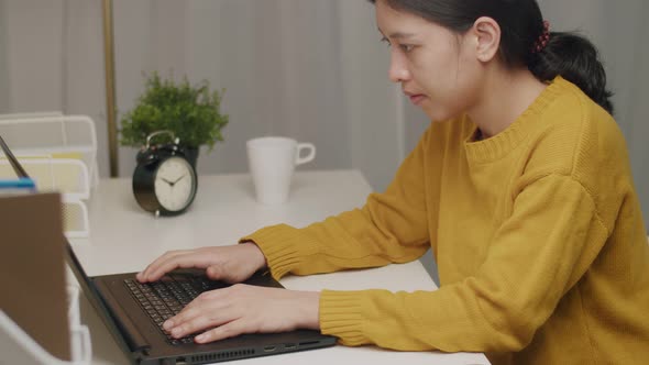 Business caucasian female working on a laptop in her home office. alt