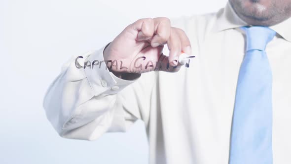 Asian Indian Businessman Writes Capital Gains Tax alt